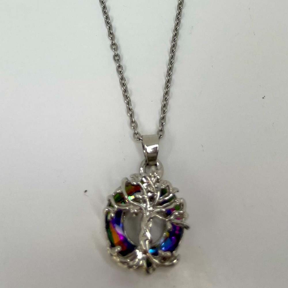 Necklace - Tree of life over purple gem. Very pretty.